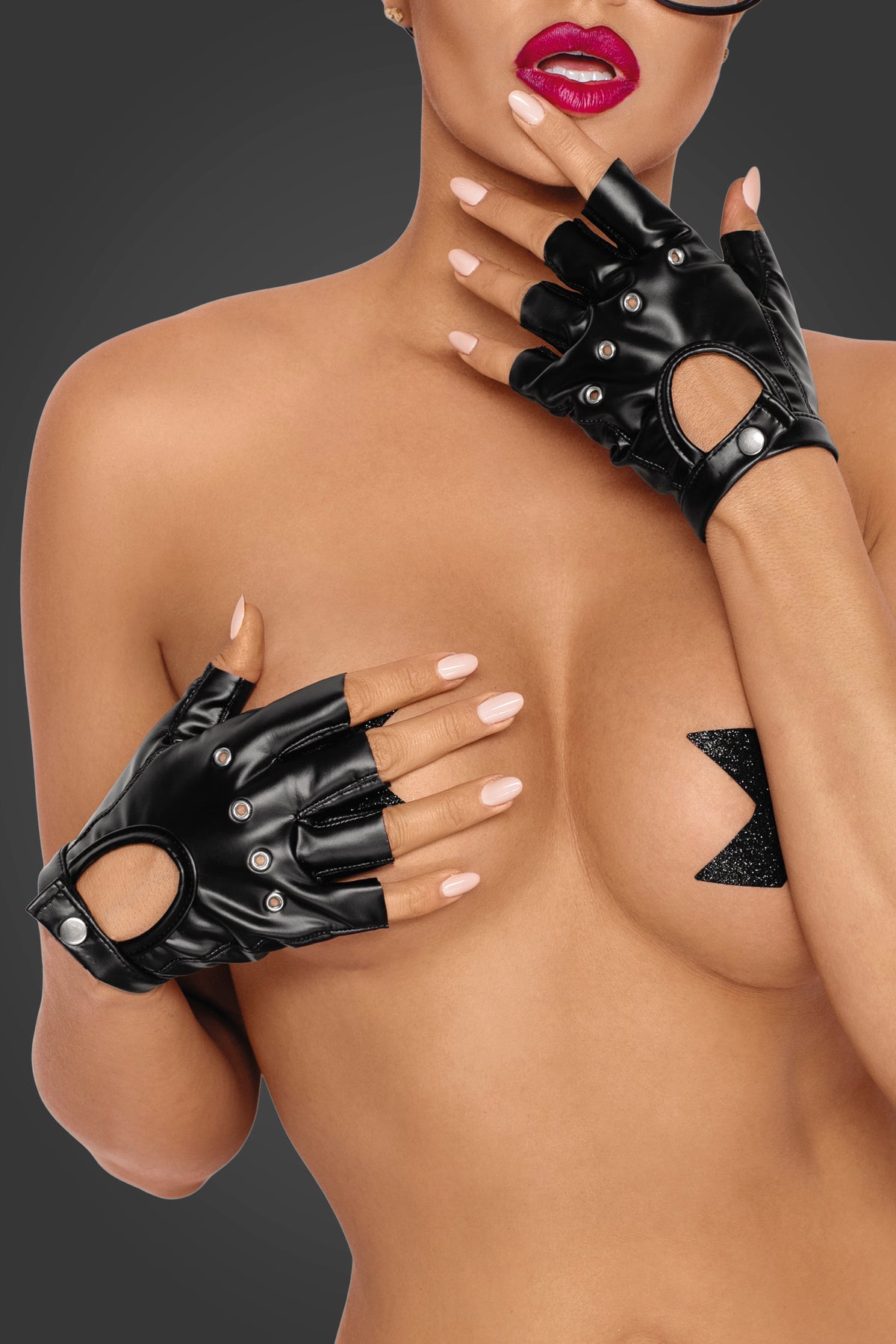 Black wetlook fingerless gloves with eyelets and hand cutouts, detail.