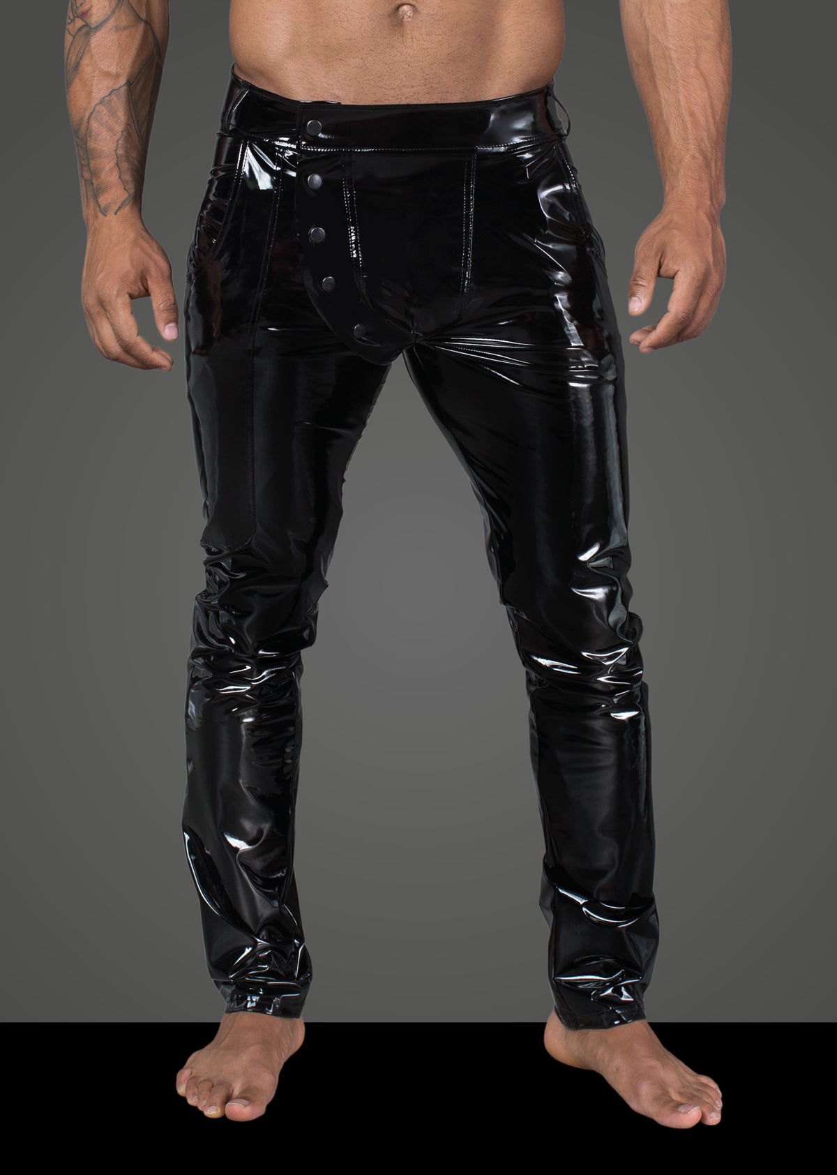 Men’s black elastic PVC trousers, front view.