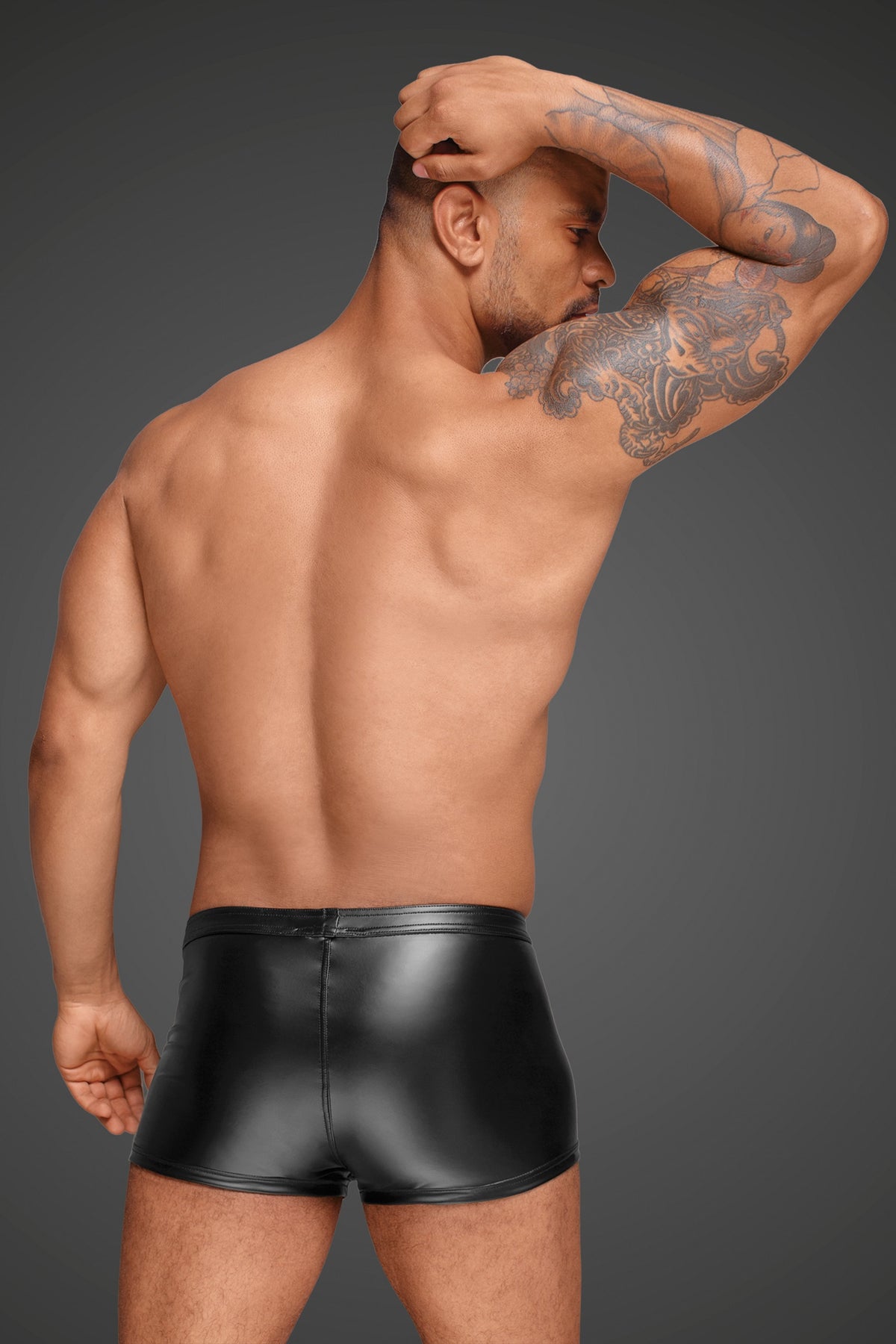 man wearing Wetlook Men's Shorts with Decorative PVC pleats back view